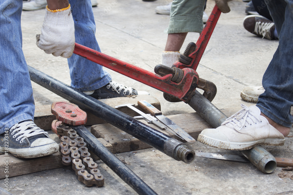 Rig workers at site take out drill core sample for geological logging, analysis and testing. Taking soil core sample