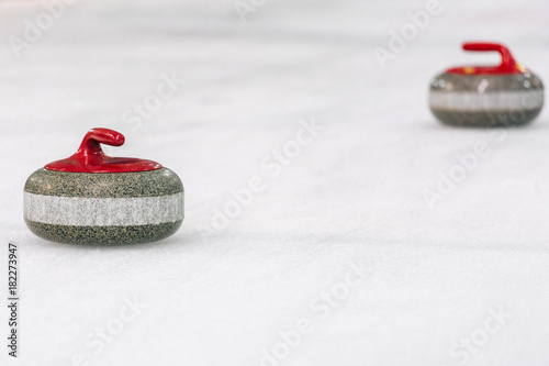 Obraz na płótnie Two Granite stones for curling game. Sport equipment w salonie