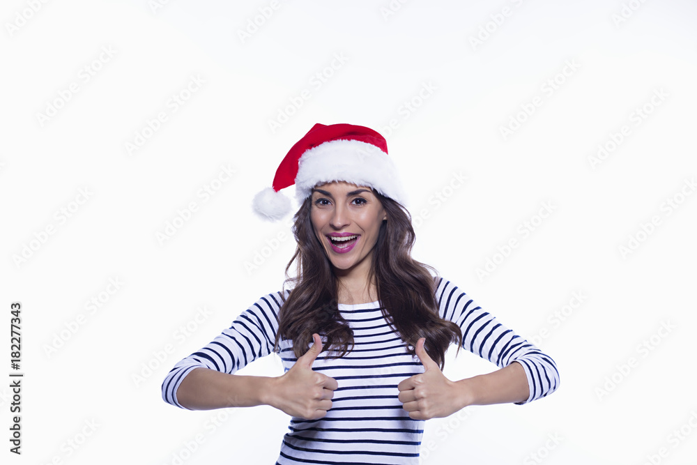 Happy New Year. Attractive young smiling woman in santa hat having fun and happy holiday on a white background isolated. Happy New Year. Attractive young smiling woman in santa hat having fun and happy holiday on a white background isolated.