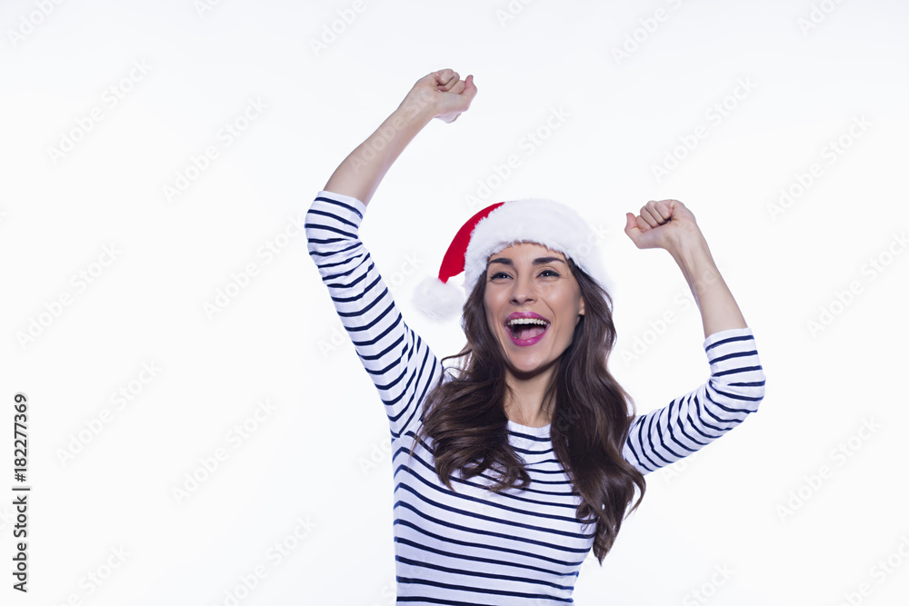 Happy New Year. Attractive young smiling woman in santa hat having fun and happy holiday on a white background isolated. Happy New Year. Attractive young smiling woman in santa hat having fun and happy holiday on a white background isolated.