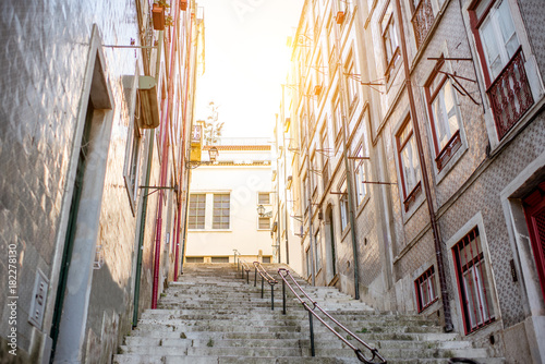 Beautiful street view with beautiful residential buildings in Mouraria district during the morning light in Lisbon city, Portugal