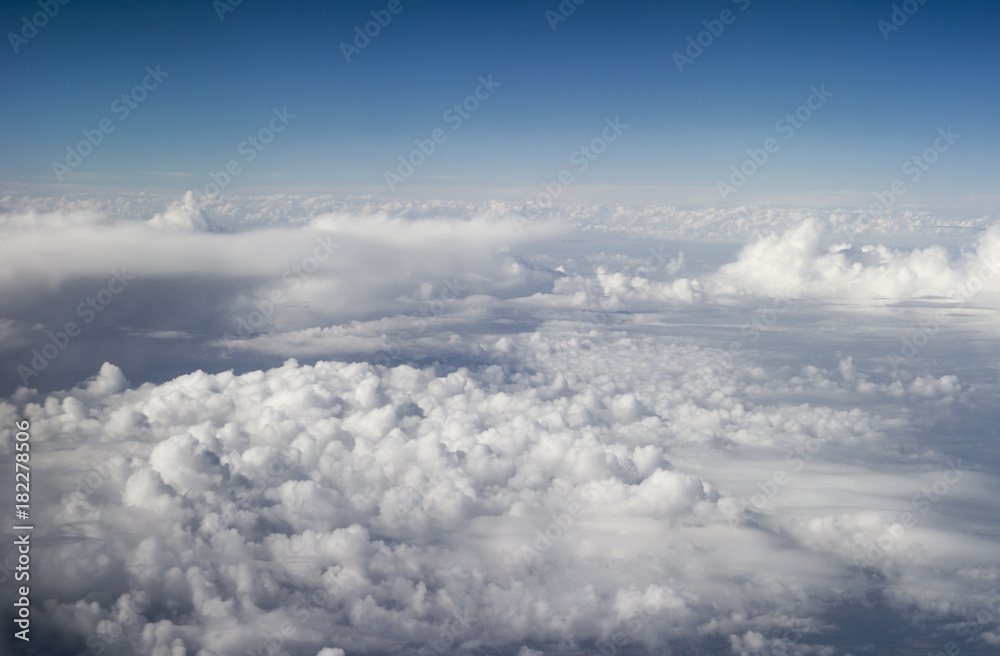 Above the clouds. White clouds.