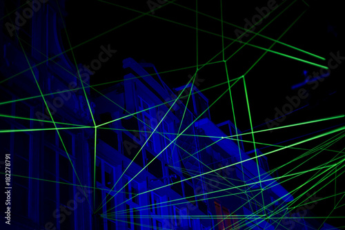 Abstract background with blue and green laser light