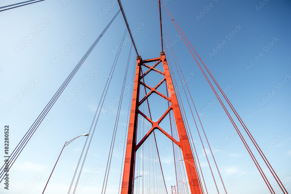 Close-up view on the construction of the famous 25th of April bridge in Lisbon city, Portugal