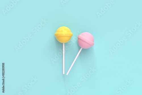 two lolipop yellow and pink on mint blue pastel background.sweet candy concept