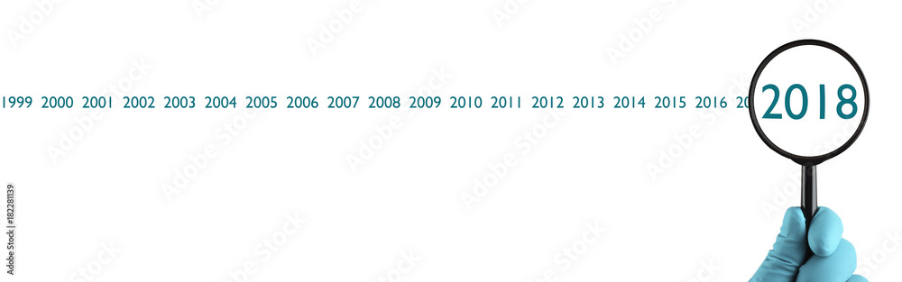 The concept of analysis. New 2018 year under magnification. Organization process, analytics, research, planning, report, market analysis. Isolated on white background.