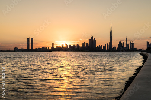 Silhouette of Dubai Downtown at sunset.