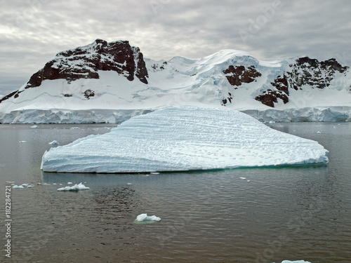 View in the Antarctic summer of mountains and ice floes in the Bismarck Strait, Antarctic Peninsula photo