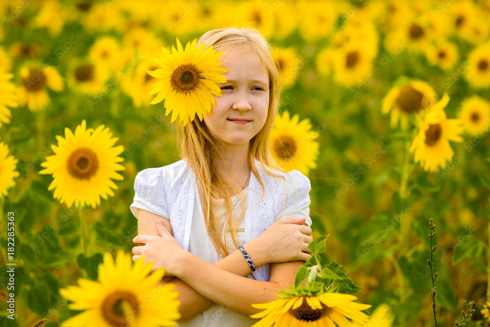 girl walking and posing in field with sunflowers girl walking and posing in field with sunflowers