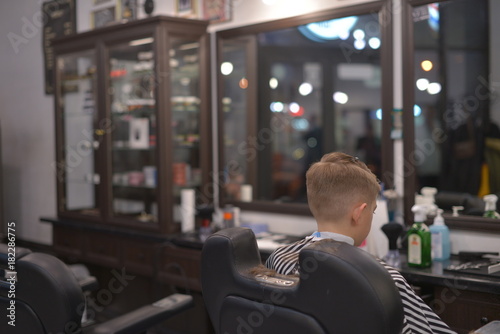 Correction of beard and haircuts in barbershop. Haircut of a man. photo