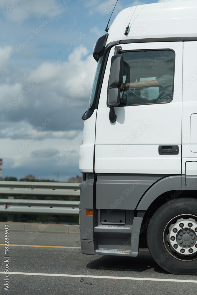 White Truck drives on a country road. Selective focus