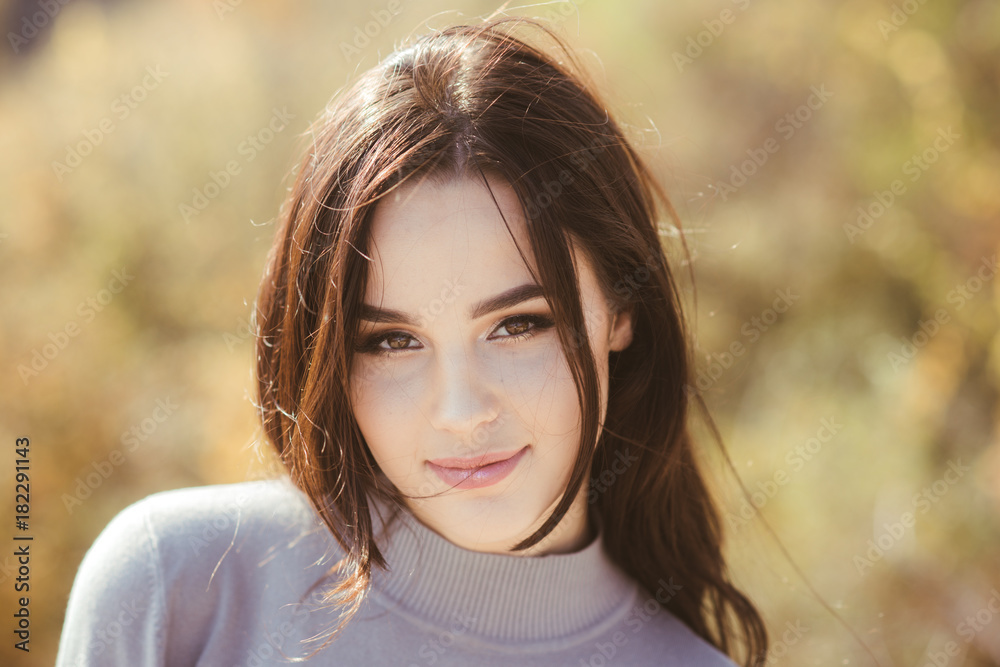 Girl with makeup face smiling on sunny day Girl with makeup face smiling on sunny day