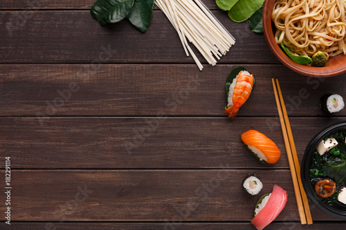 Asian food on wooden background, copy space