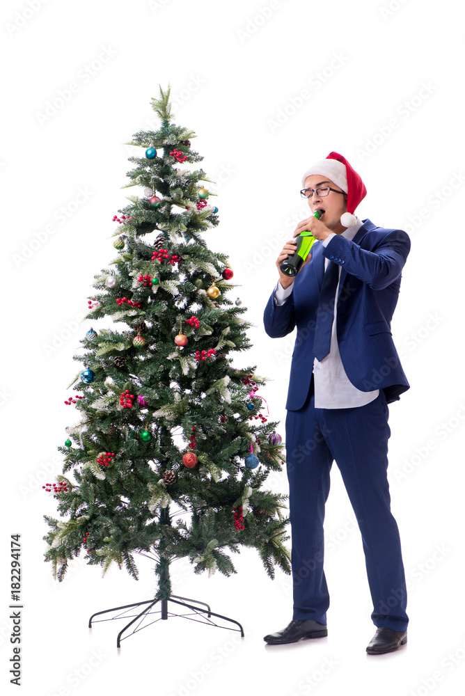 Businessman decorating christmas tree isolated on white Businessman decorating christmas tree isolated on white
