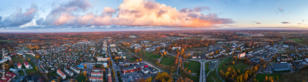 Aerial view of the city at sunset. Beautiful autumn city landscape. Panorama.