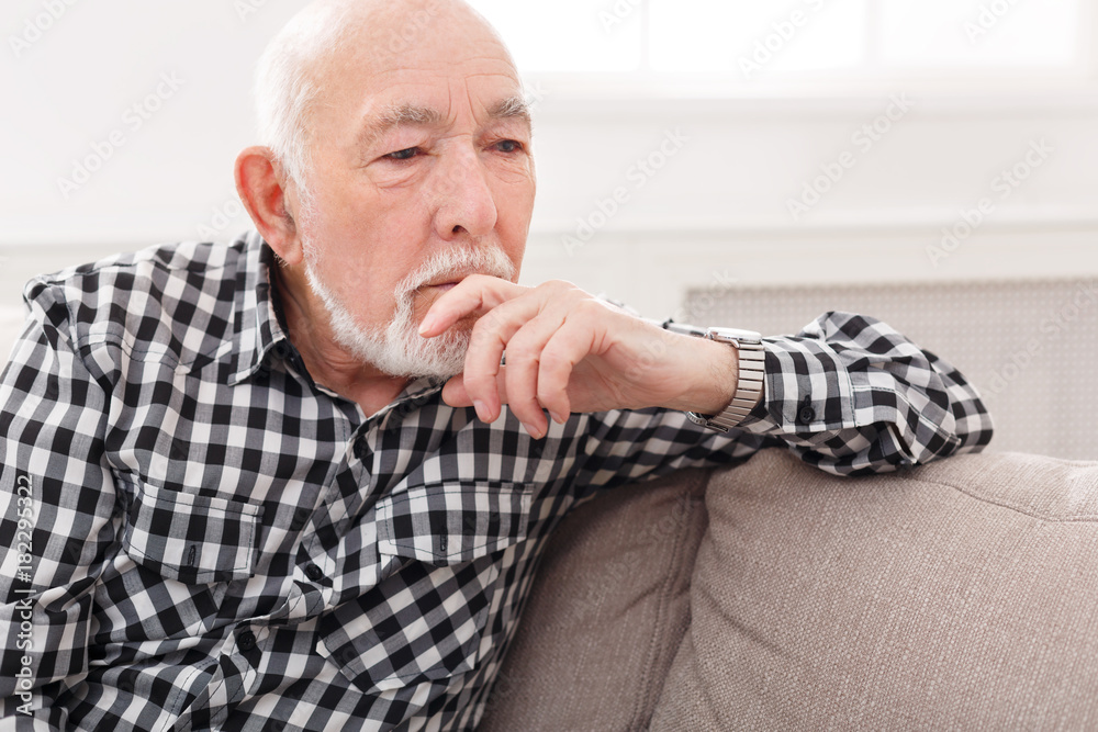 Pensive elderly man portrait, copy space