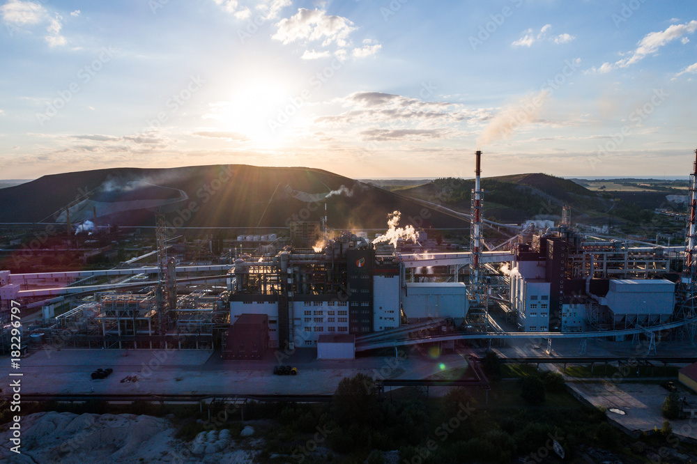 © nikwaller - Aerial view Oil refinery with a background of mountains and sky at sunset. Aerial photography. Kohtla-Järve city, Estonia, Ida-Virumaa. © nikwaller - Aerial view Oil refinery with a background of mountains and sky at sunset. Aerial photography. Kohtla-Järve city, Estonia, Ida-Virumaa.