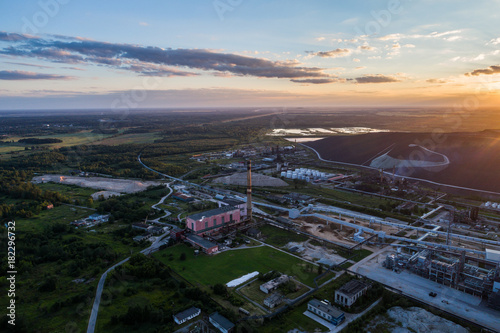 Aerial view Oil refinery with a background of mountains and sky at sunset. Aerial photography. Kohtla-Järve city, Estonia, Ida-Virumaa.