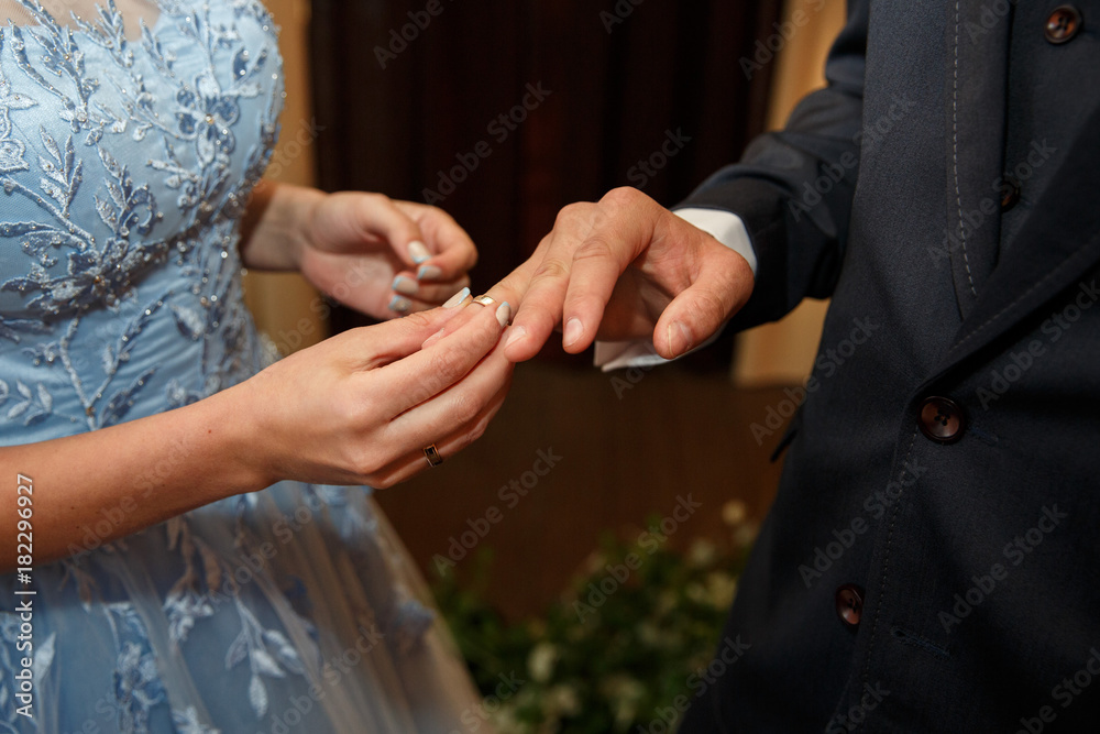 Wedding ceremony with wedding rings for bride and groom