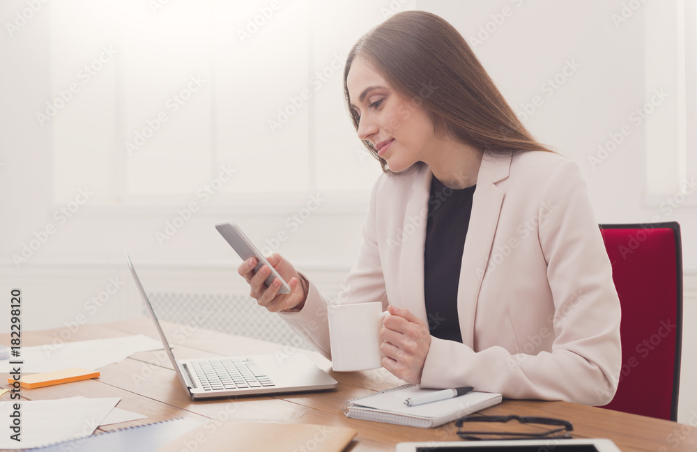 Young business woman working on phone Young business woman working on phone