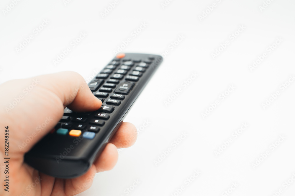Television remote control in the hand on white background Television remote control in the hand on white background