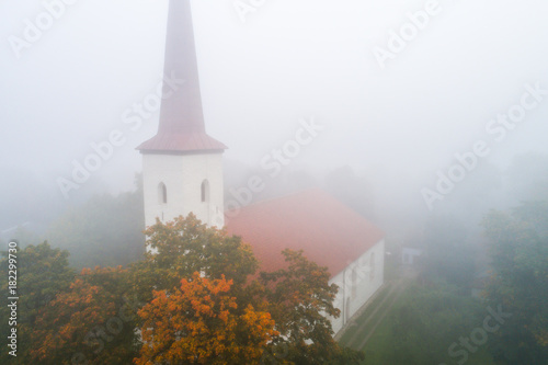 Aerial view of the church in fog.
