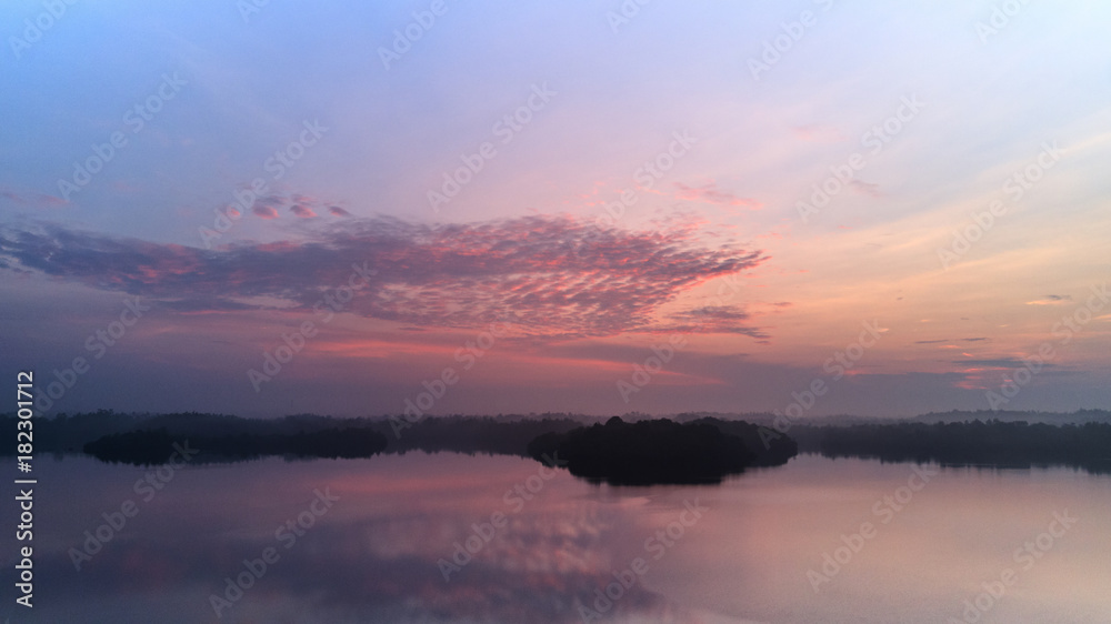 beautiful sunrise over tropical lake aerial shot