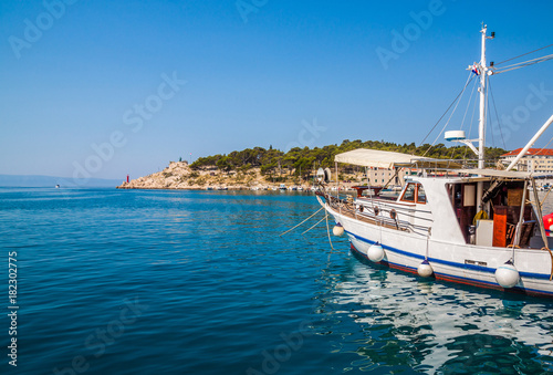 Motor boats parked at pier in Makarska city. Popular tourist destination. Croatia