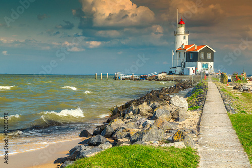 Spectacular seascape with famous lighthouse in Marken, Netherlands, Europe