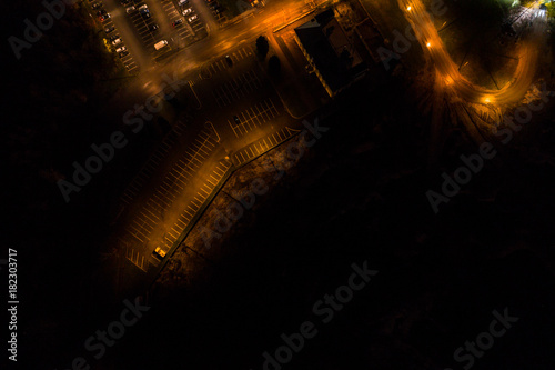 Aerial view of oil refinery. Industrial view at oil refinery plants with lots of light at night.  © nikwaller