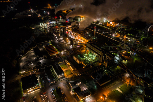 Aerial view of oil refinery. Industrial view at oil refinery plants with lots of light at night.  © nikwaller