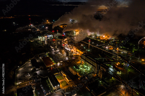 Aerial view of oil refinery. Industrial view at oil refinery plants with lots of light at night.  photo