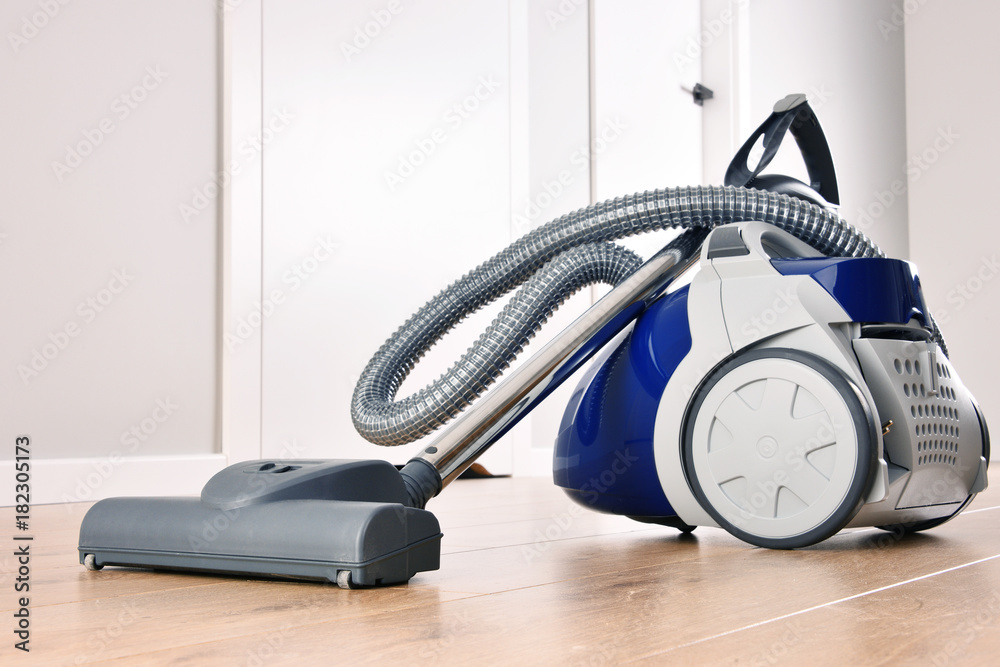 Canister vacuum cleaner for home use on the floor panels Canister vacuum cleaner for home use on the floor panels