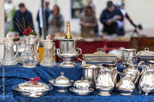 Champagne cooler and other silverware on flea market