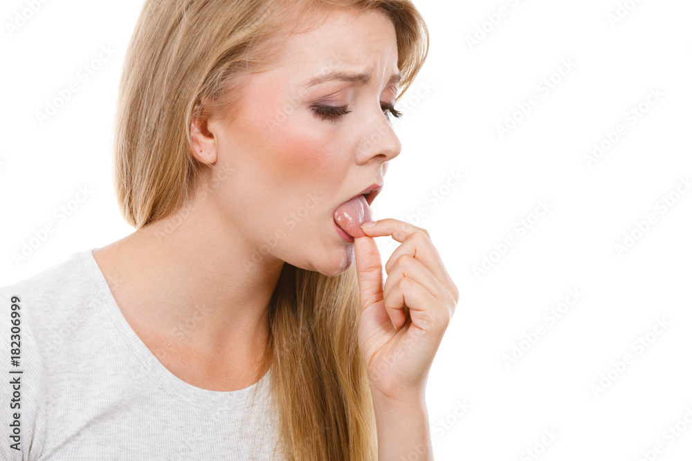 Woman having something disgusting on tongue Woman having something disgusting on tongue
