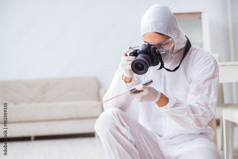 Forensic expert at crime scene doing investigation Forensic expert at crime scene doing investigation