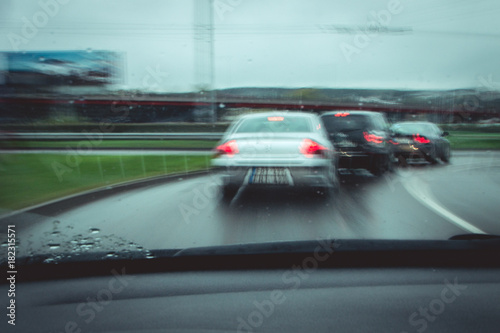 view from the car from the driver's seat. traffic of cars on the road. motion blur