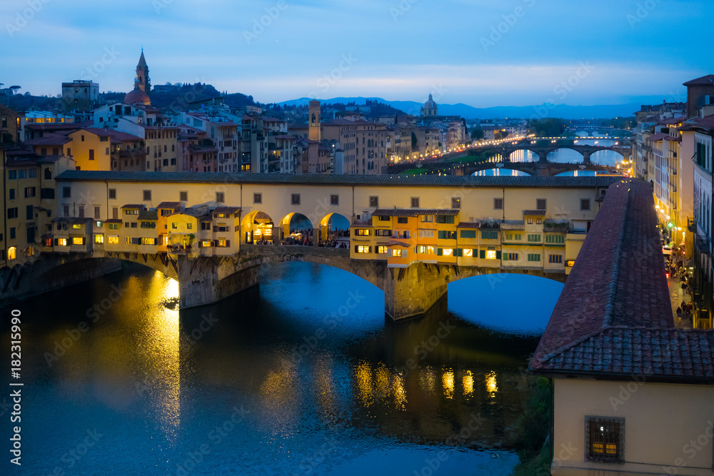 River Arno and famous bridge Ponte Vecchio at sunset from Ponte alle Grazie in Florence, Tuscany, Italy aerial view