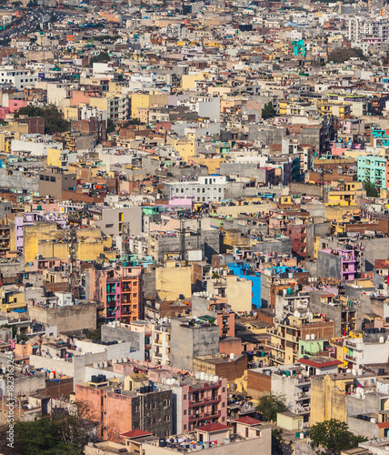 Top view on chaos of colored buildings - the heap of houses in the Asian cities caused by big overpopulation. © Dymov