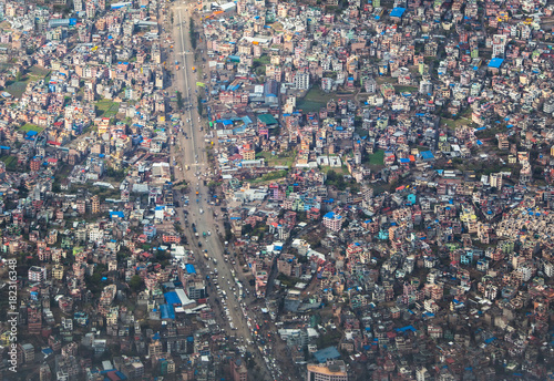 Top view on chaos of colored buildings - the heap of houses in the Asian cities caused by big overpopulation. #182316348