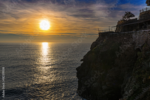 Sunset at Ligurian coastline near Riomaggiore town in Cinque Terre National park, Italy