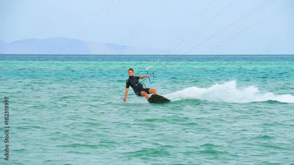 Young girl Kite Surfing In Ocean, Extreme summer sport hd, slow motion Young girl Kite Surfing In Ocean, Extreme summer sport hd, slow motion