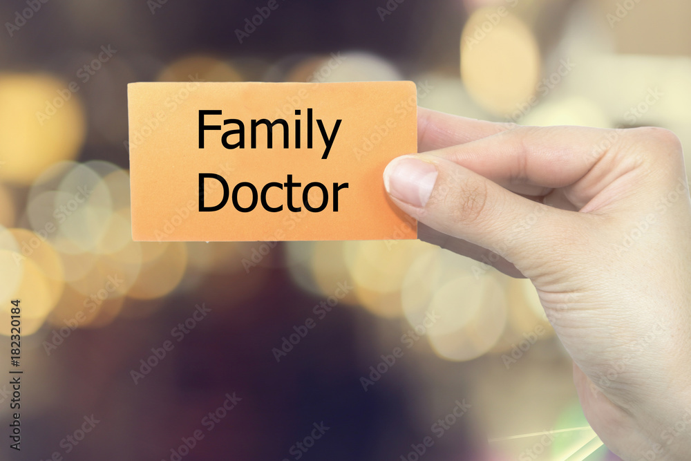 Φωτογραφία Doctor holding a white paper with Family doctor sign on the display