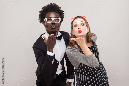 Love concept. Couple send air kisses at camera photo