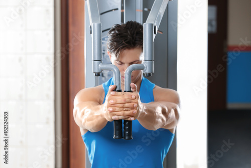 Muscular young man training...