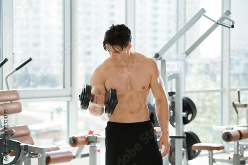 Muscular young man training...