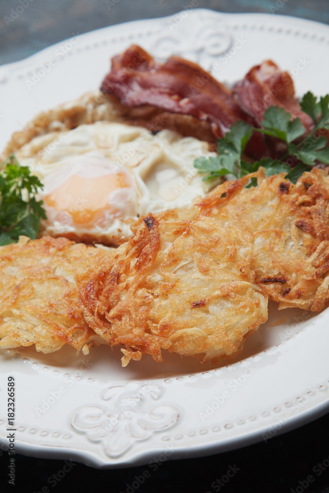 Hash browns with egg and bacon Hash browns with egg and bacon