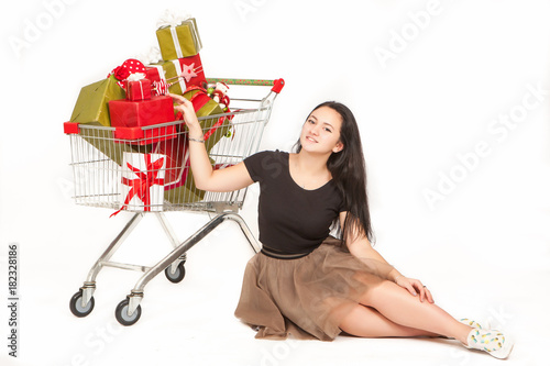 Girl with shopping cart. Th...