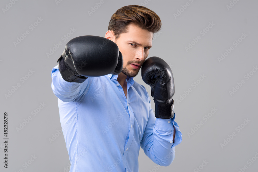 Handsome elegant man with boxer gloves Handsome elegant man with boxer gloves