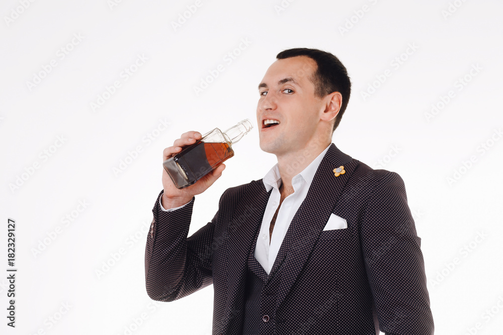 Confident well-dressed man drinking whiskey Confident well-dressed man drinking whiskey